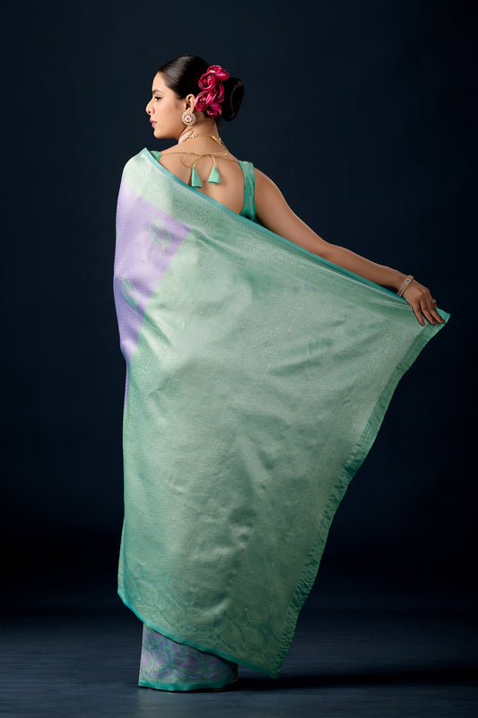 Woman draping lilac purple mint green leaf motif zari pallu silk saree showing pallu design — Chandrikas