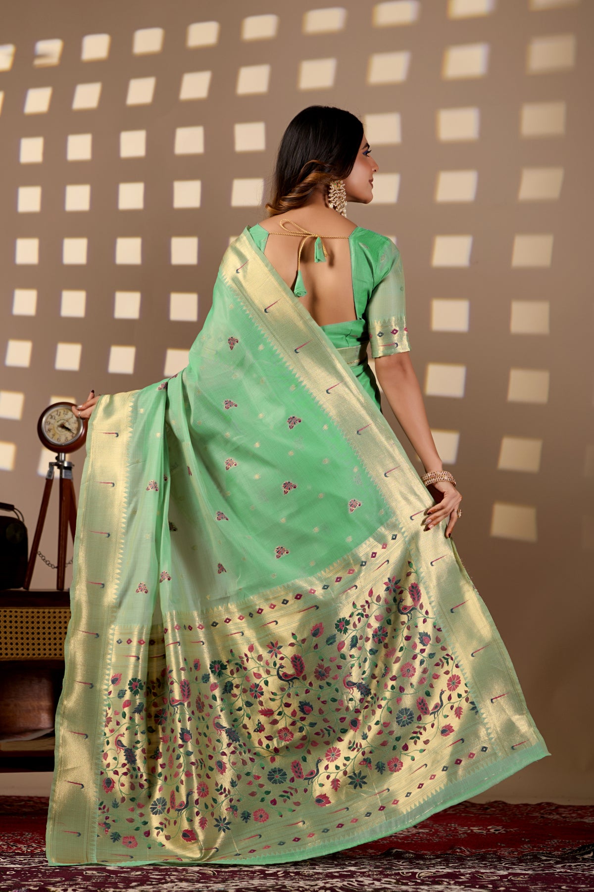 Woman draping lime green Banarasi-Paithani Meenakari cotton zari pallu saree showing peacock motif — Chandrikas
