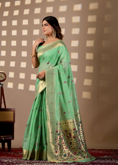 Woman in standing pose wearing lime green Banarasi-Paithani Meenakari cotton zari pallu saree — Chandrikas