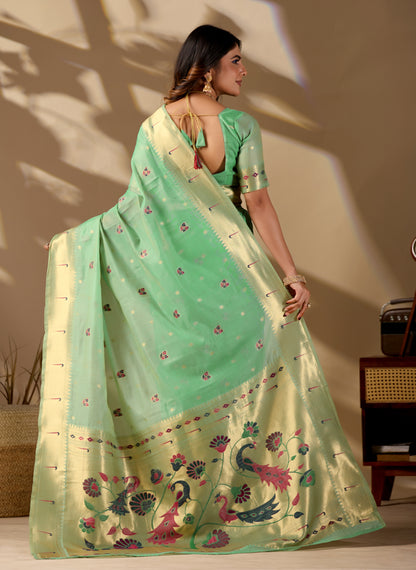 Woman draping lime green Banarasi-Paithani zari pallu cotton saree showing peacock motif — Chandrikas