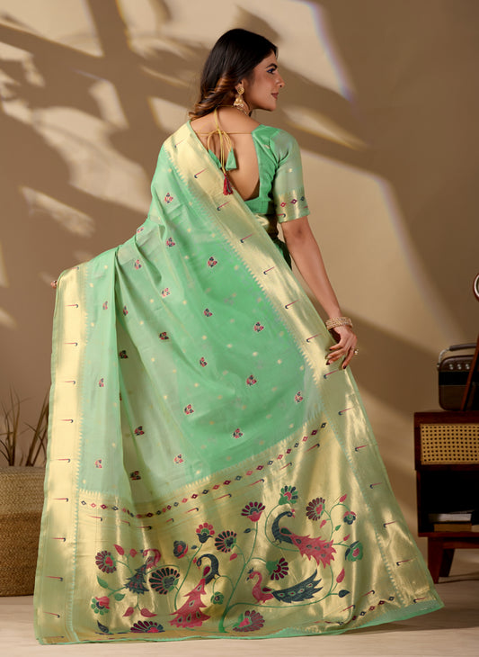 Woman draping lime green Banarasi-Paithani zari pallu cotton saree showing peacock motif — Chandrikas