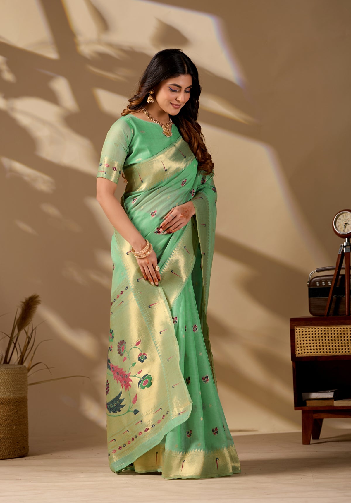 Woman in standing pose wearing lime green Banarasi-Paithani zari pallu cotton saree — Chandrikas