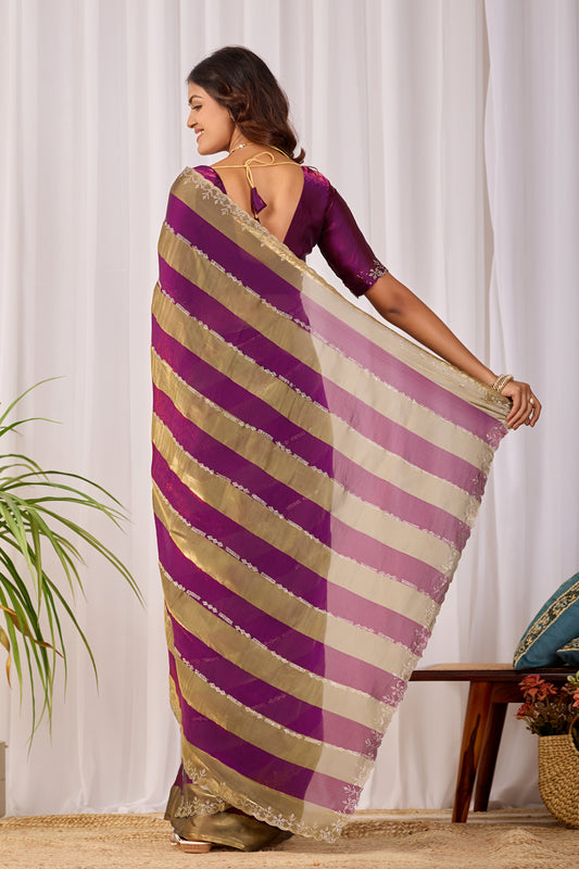 Woman in back pose wearing magenta purple striped satin patta saree with golden pallu — Chandrikas