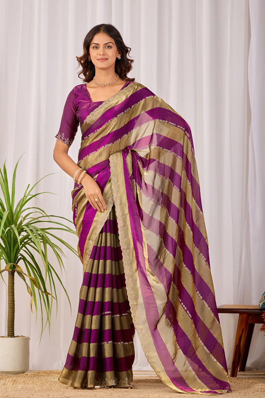 Woman in front pose wearing magenta purple striped satin patta saree with golden border — Chandrikas