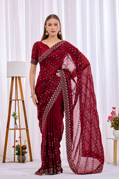 Side pose showing pleats and border of Maroon satin floral thread work designer border saree — Chandrikas