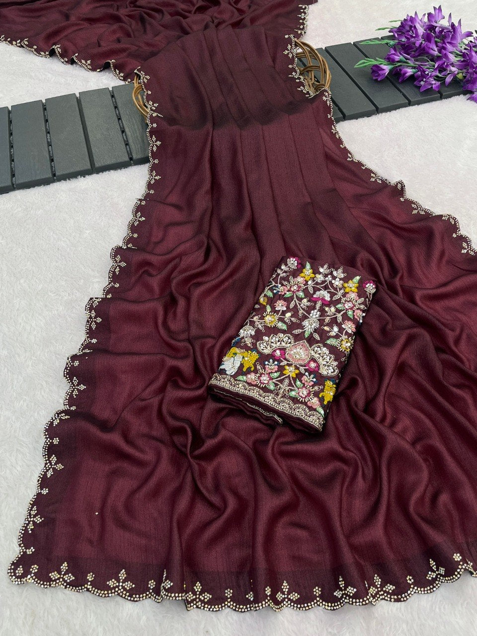 Maroon wine Tesla saree flatlay with floral embroidered border and matching blouse — Chandrikas