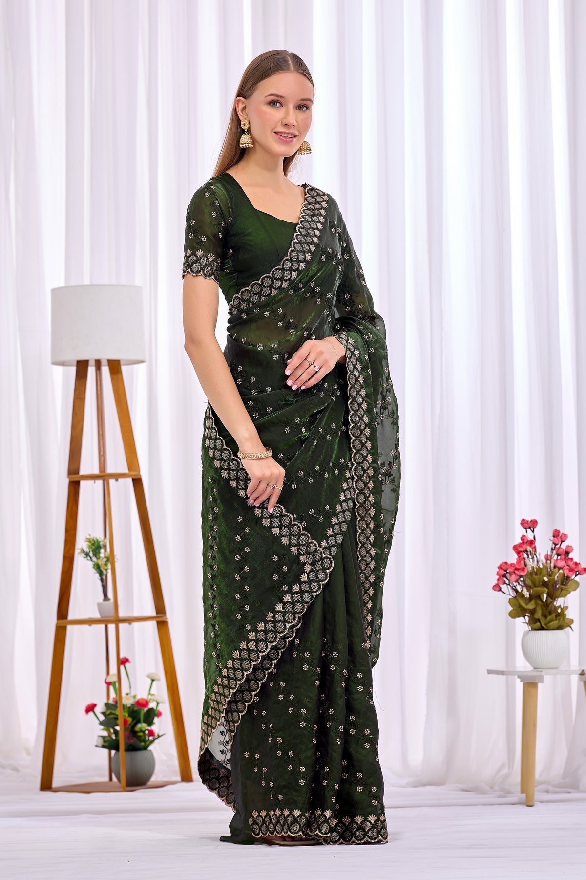 Side pose showing pleats and border of Mehendi Green satin floral thread work designer border saree — Chandrikas