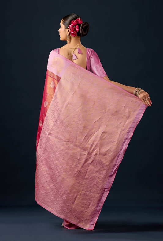 Woman draping metallic rust pink silk matka motif border saree showing pallu design — Chandrikas
