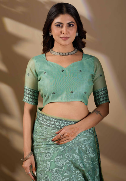 Woman in close pose wearing mint green Banarasi cotton jacquard jaal saree — Chandrikas
