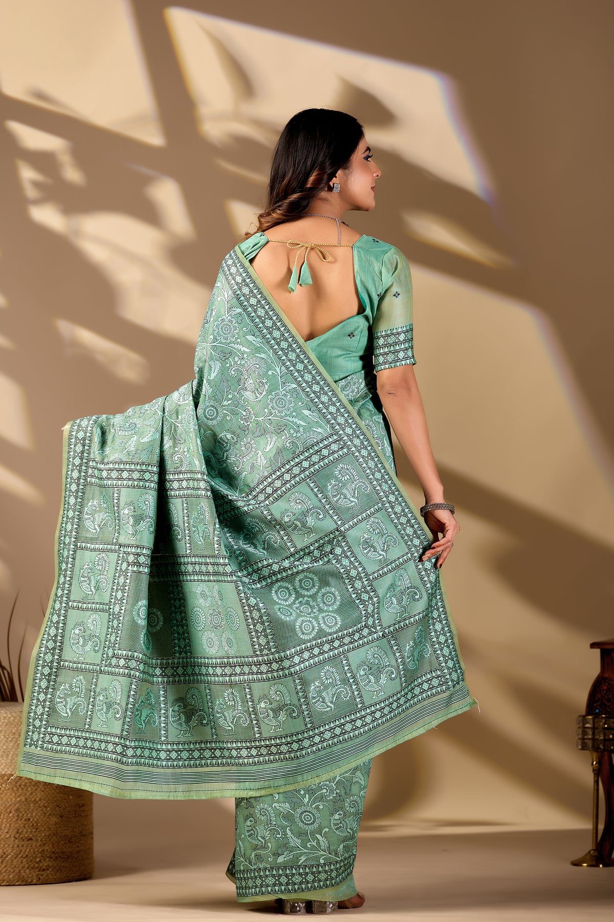 Woman draping mint green Banarasi cotton jacquard jaal saree showing pallu motif — Chandrikas