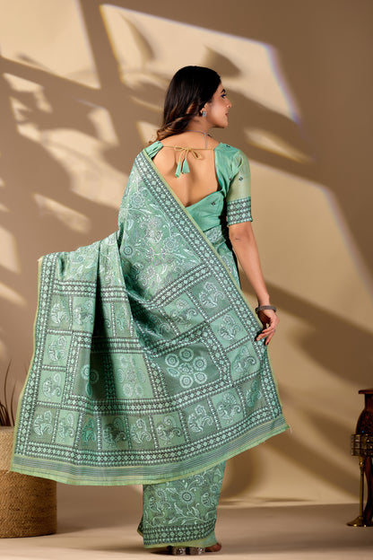 Woman draping mint green Banarasi cotton jacquard jaal saree showing pallu motif — Chandrikas