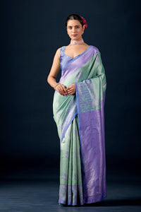 Woman in front pose wearing mint green lavender leaf motif zari pallu silk saree — Chandrikas