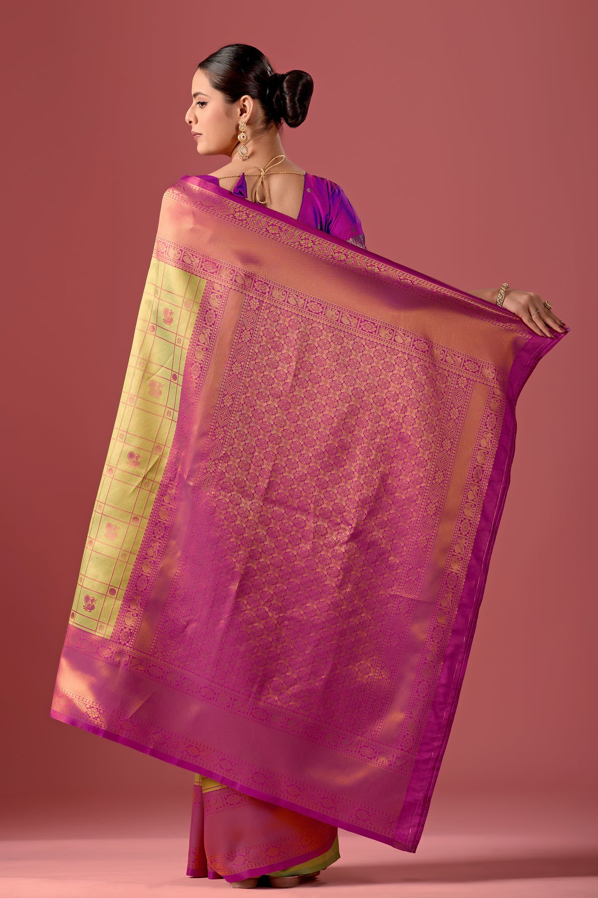 Woman draping mint green pink Banarasi silk checks pattern saree showing pallu design — Chandrikas