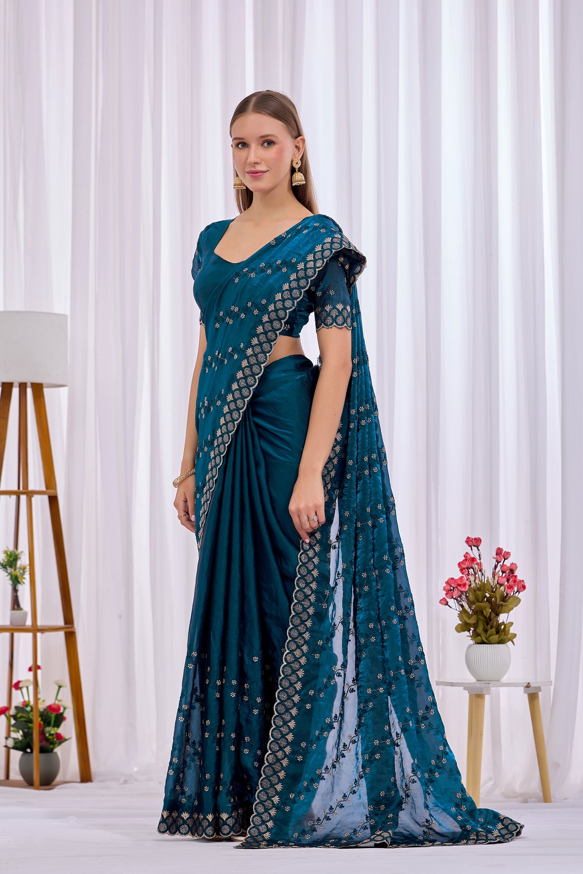 Pallu drape detail of Mor Peach satin floral thread work designer border saree with all-over embroidery — Chandrikas