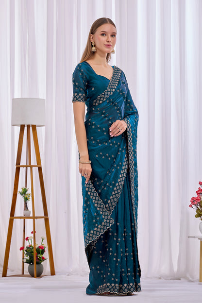 Side pose showing pleats and border of Mor Peach satin floral thread work designer border saree — Chandrikas