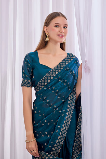 Stylish pose in Mor Peach satin floral thread work designer border saree showing embellished border — Chandrikas