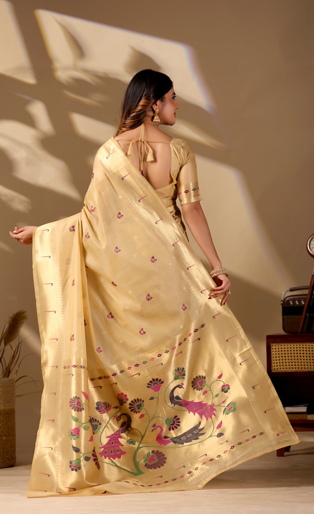 Woman draping mustard yellow Banarasi-Paithani zari pallu cotton saree showing peacock motif — Chandrikas