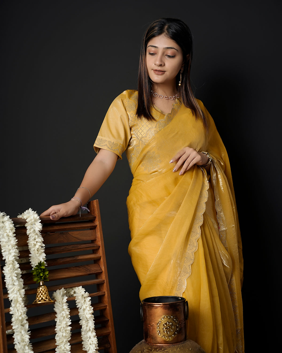 Woman in front pose wearing mustard yellow tissue crepe silk saree with scalloped border — Chandrikas