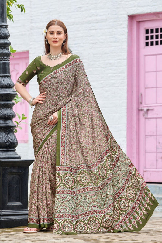Woman wearing an olive green Ajrakh print mirror work Italian crepe saree with matching blouse — Chandrikas