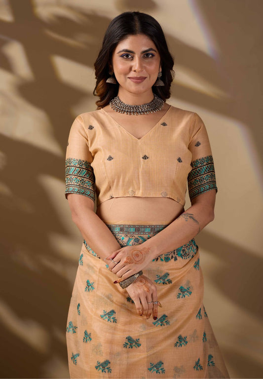 Woman in close pose wearing peach Banarasi cotton jacquard bird buttis saree — Chandrikas