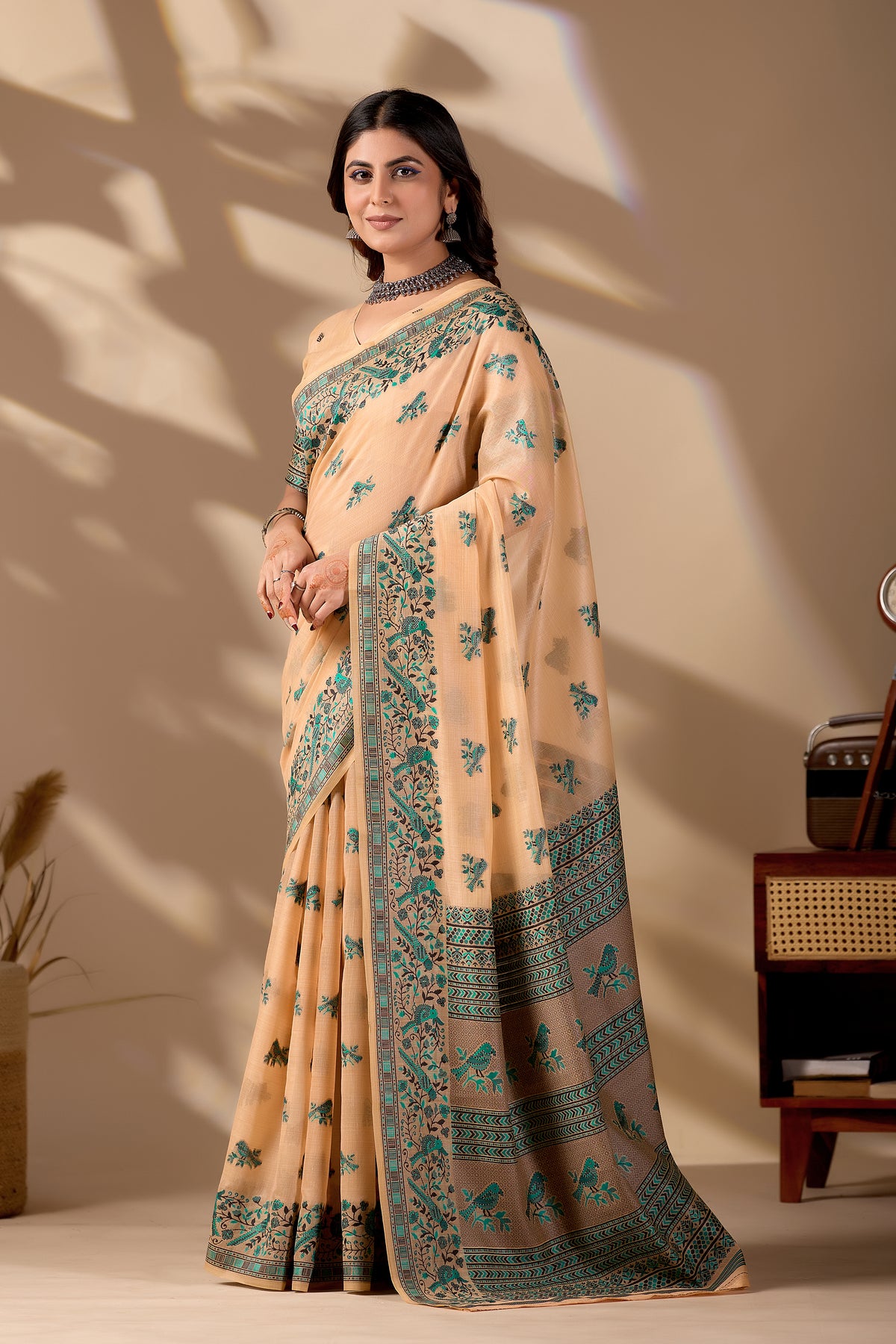 Woman in standing pose wearing peach Banarasi cotton jacquard bird buttis saree — Chandrikas