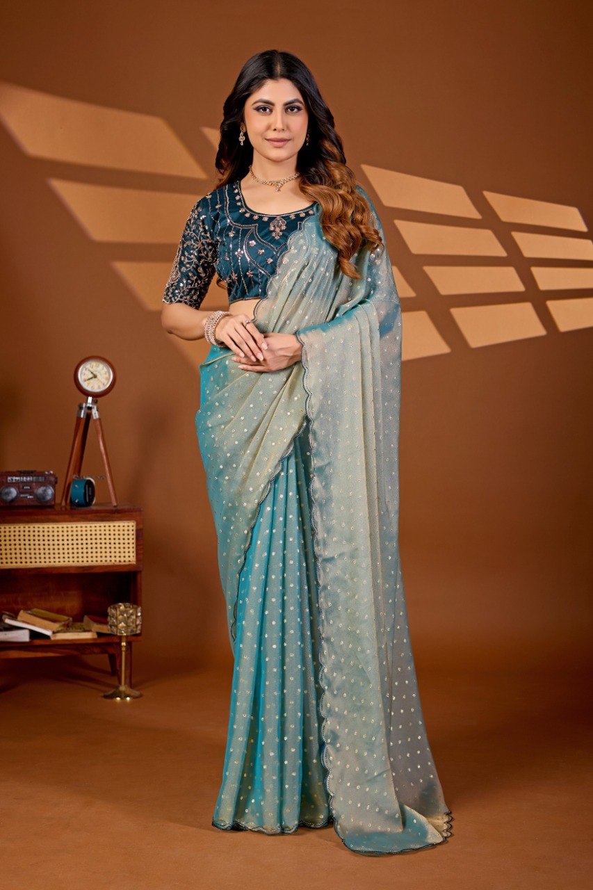 Woman wearing a peach coral sequin work chiffon silk saree with embroidered blouse — Chandrikas