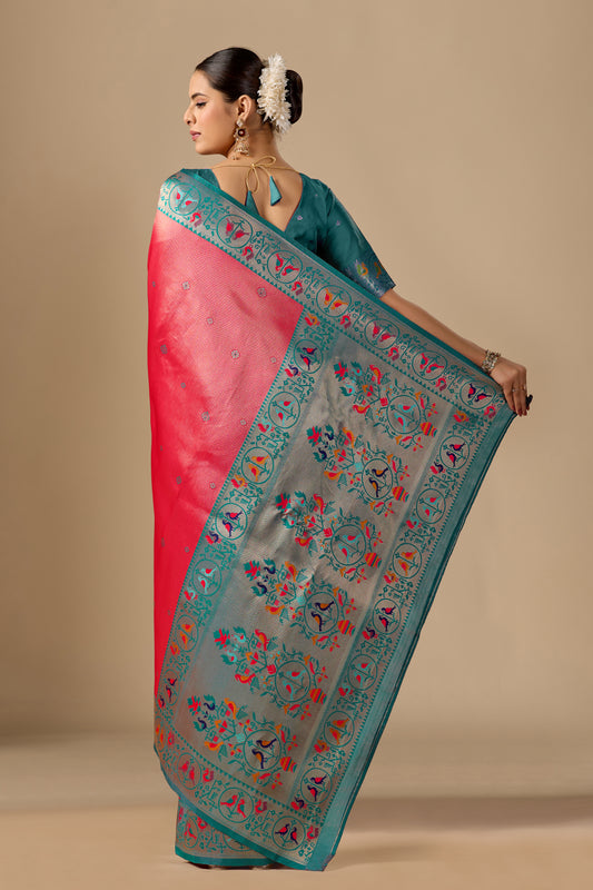 Woman draping peach Paithani silk bird border pallu saree showing bird motif — Chandrikas