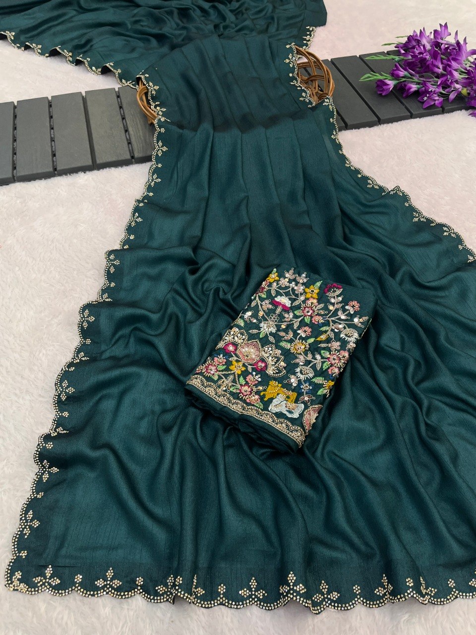 Peacock teal Tesla saree flatlay with floral embroidered border and matching blouse — Chandrikas