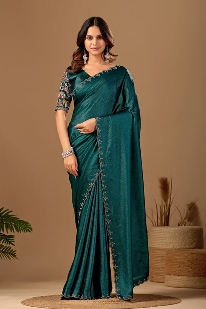 Woman wearing a peacock teal Tesla saree with floral embroidered blouse and border — Chandrikas