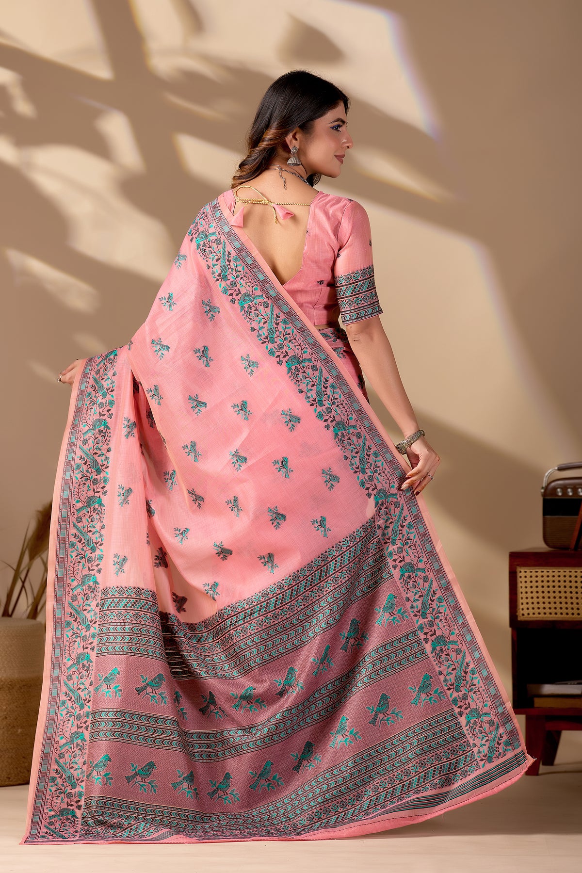 Woman draping pink Banarasi cotton jacquard bird buttis saree showing pallu motif — Chandrikas