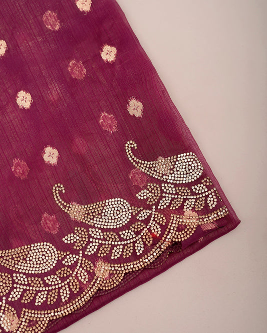 Close-up of pink magenta tissue crush saree fabric showing Jharkan elephant motif border — Chandrikas