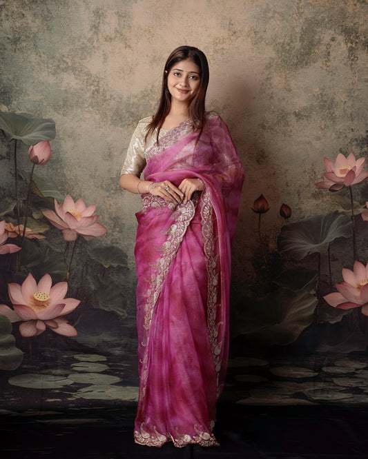 Woman in side pose wearing pink magenta double shade tissue crush Jharkan border saree — Chandrikas