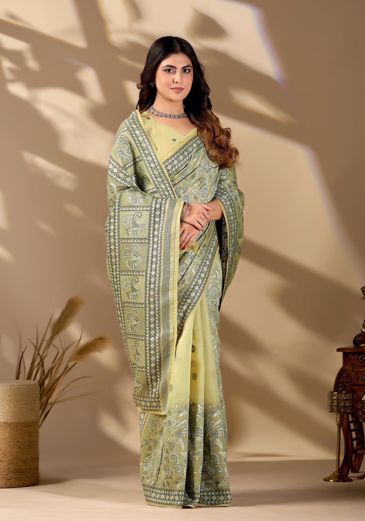 Woman in standing pose wearing pista green Banarasi cotton jacquard jaal saree — Chandrikas