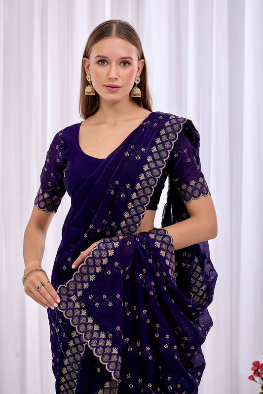 Stylish pose in Purple satin floral thread work designer border saree holding the embellished pallu — Chandrikas