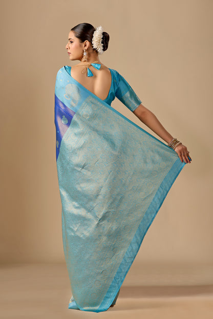Woman draping purple sky blue silk matka motif border saree showing pallu design — Chandrikas