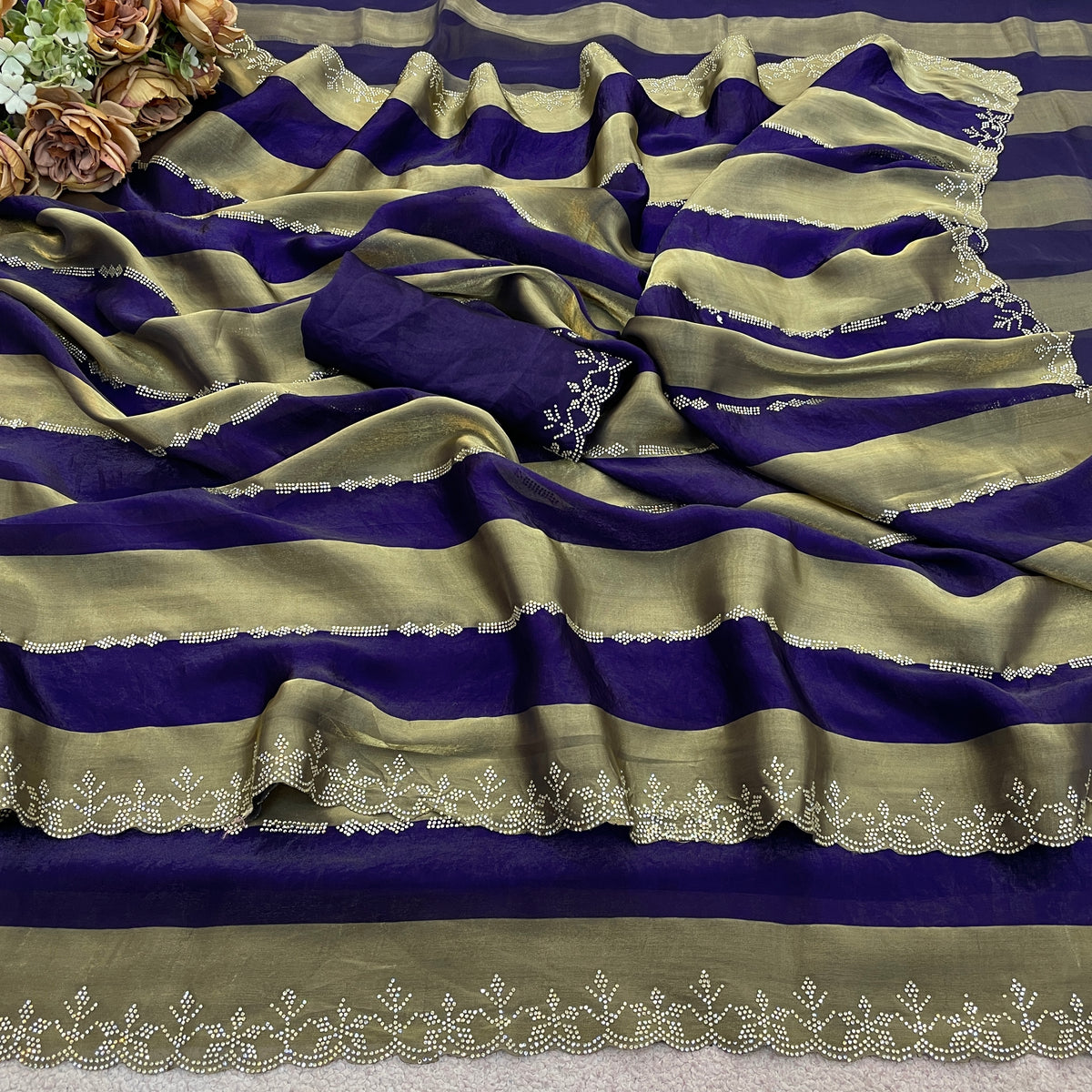 Royal purple striped satin patta saree flatlay with golden border and blouse — Chandrikas