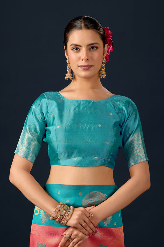 Woman in close pose wearing rama green orange silk matka motif border saree — Chandrikas