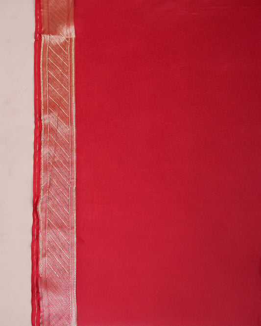 Close-up of red Banarasi silk matching blouse piece fabric edge — Chandrikas