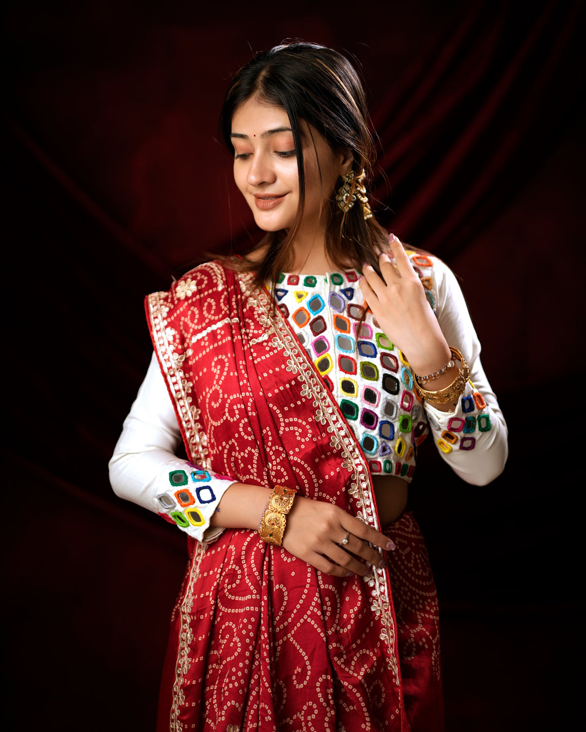 Woman draping red Bandhani saree showing Gota Patti pallu border — Chandrikas