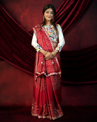 Woman in standing pose wearing red Bandhani saree with Gota Patti zari border — Chandrikas