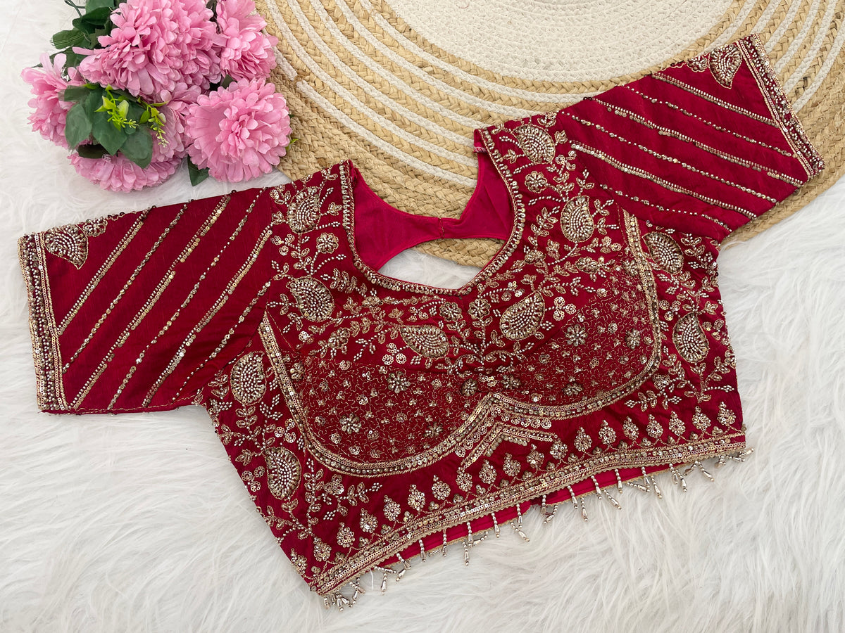 Red sequin embroidered designer blouse flatlay showing sleeve detail — Chandrikas