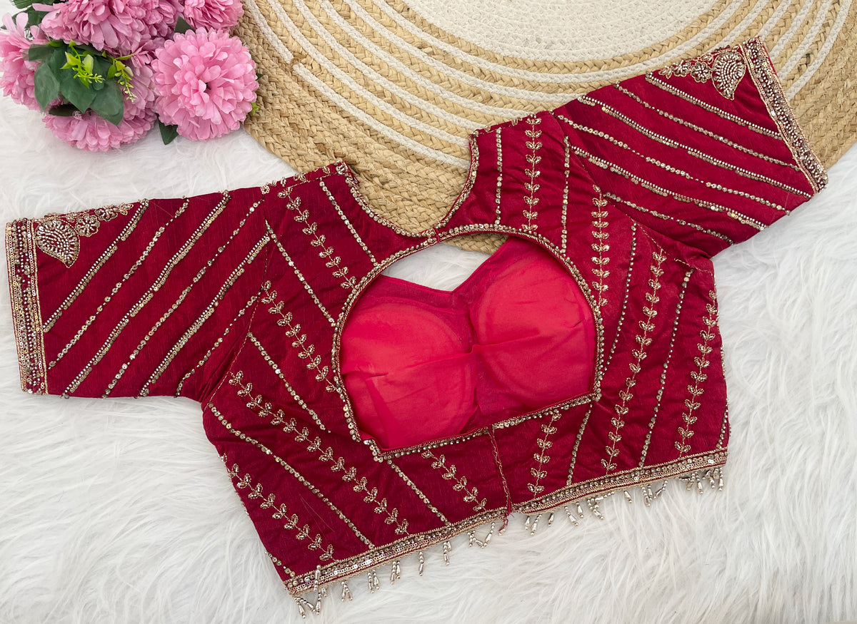 Red sequin embroidered designer blouse flatlay showing neckline detail — Chandrikas