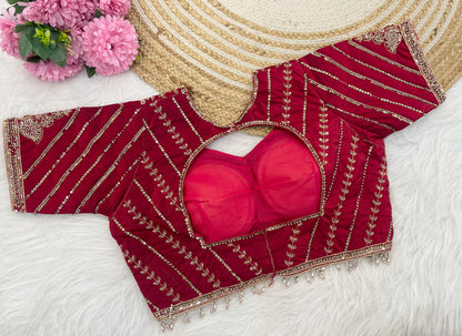 Red sequin embroidered designer blouse flatlay showing neckline detail — Chandrikas