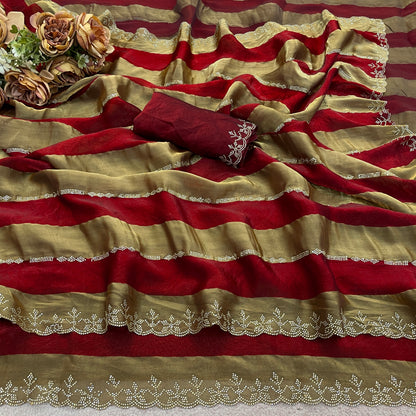 Closeup of red striped satin patta saree flatlay showing golden border detail — Chandrikas