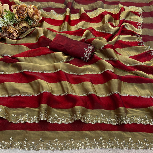 Closeup of red striped satin patta saree flatlay showing golden border detail — Chandrikas