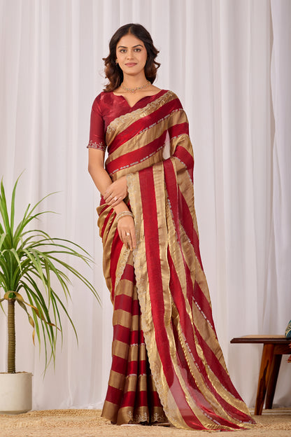 Woman in front pose wearing red striped satin patta saree with golden border — Chandrikas