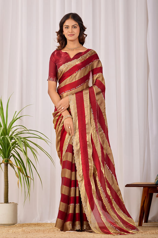 Woman in front pose wearing red striped satin patta saree with golden border — Chandrikas