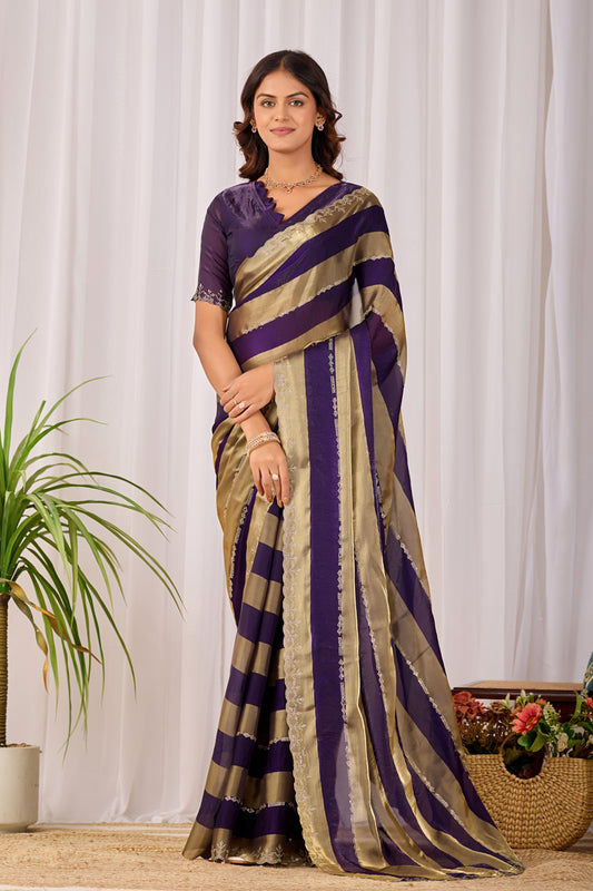 Woman in front pose wearing royal purple striped satin patta saree with golden border — Chandrikas