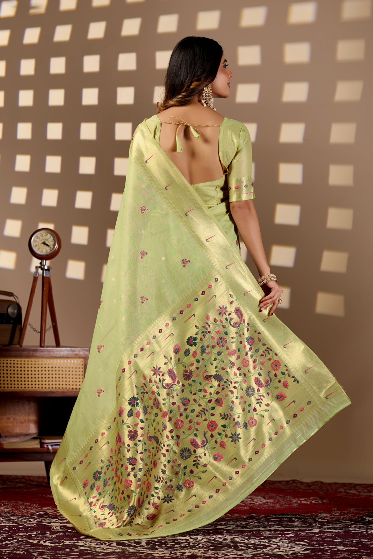 Woman draping sea green Banarasi-Paithani Meenakari cotton zari pallu saree showing peacock motif — Chandrikas