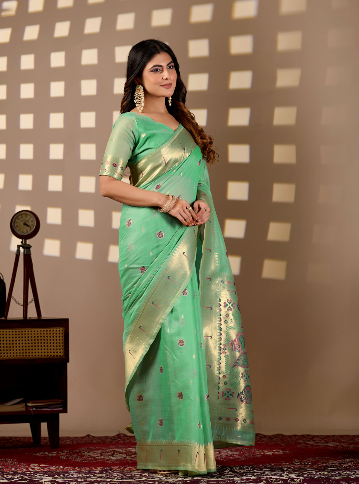Woman in side pose wearing sea green Banarasi-Paithani Meenakari cotton saree — Chandrikas
